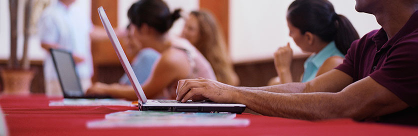 Man using a laptop in class.