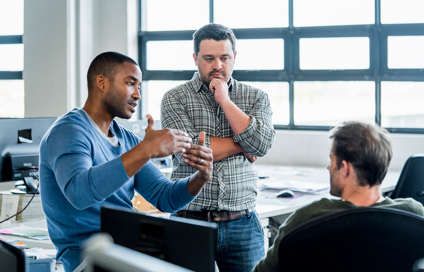 Men discussing in the office