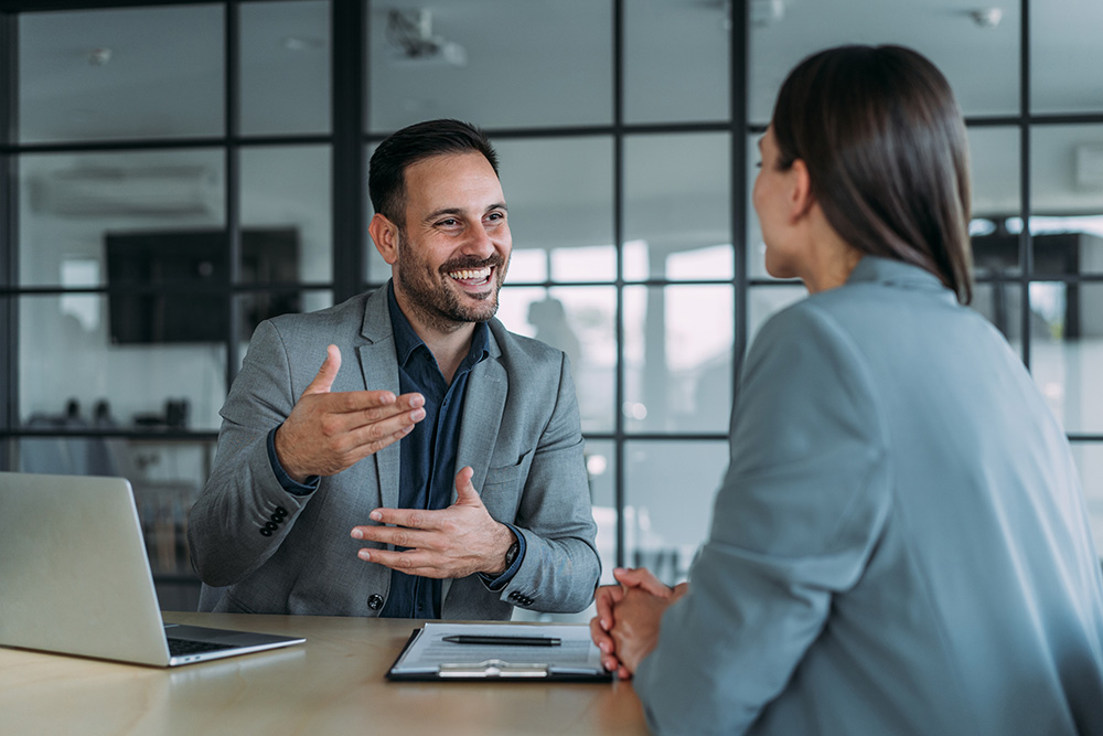 Two people talking at work